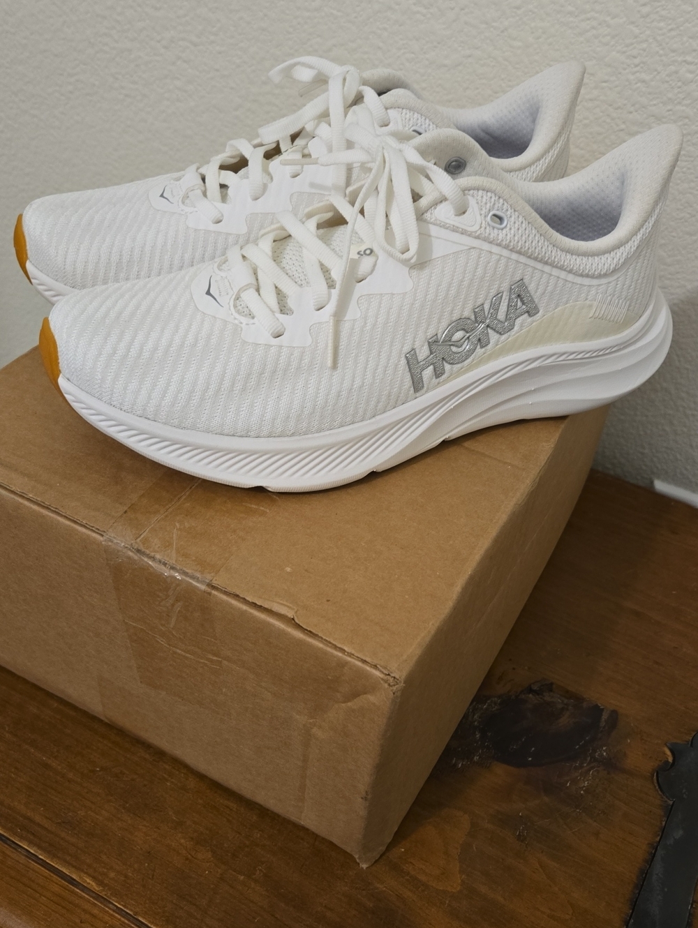 Hoka Women's White Athletic Running Shoes with Yellow Toe Accent